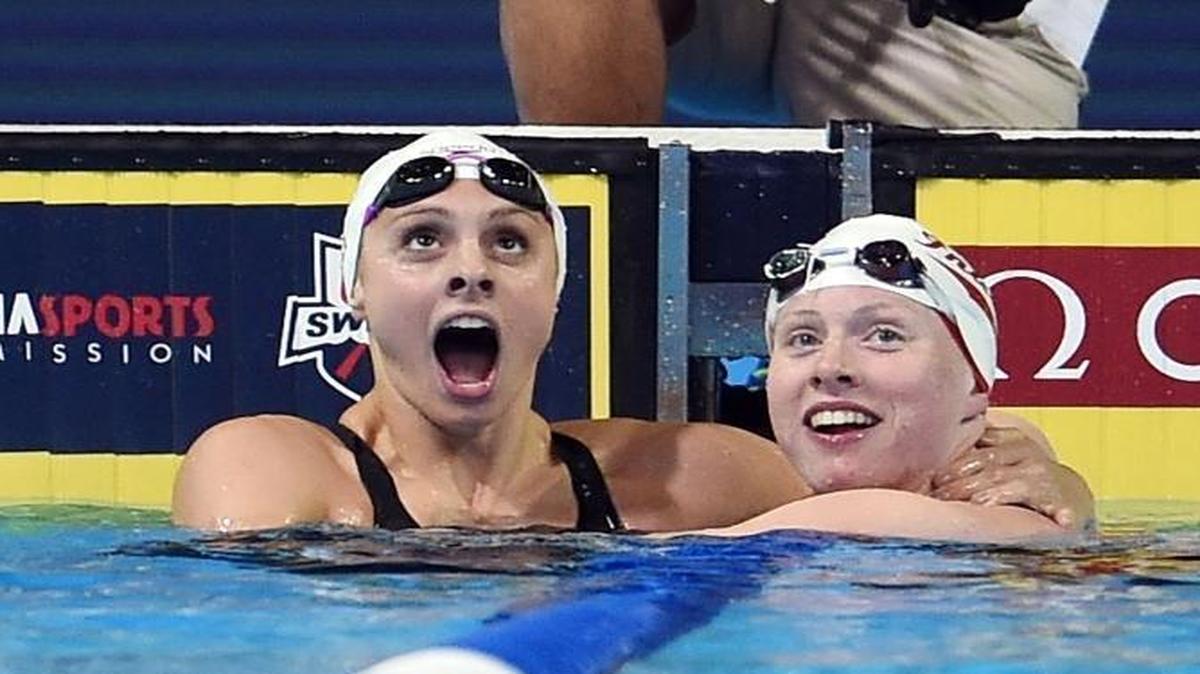 Lilly King, right, is congratulated by Katie Meili after winning the final heat of the Women's 100 Meter Breaststroke during Day 3 of the 2016 U.S. Olympic Team Swimming Trials at CenturyLink Center on Tuesday in Omaha, Neb.