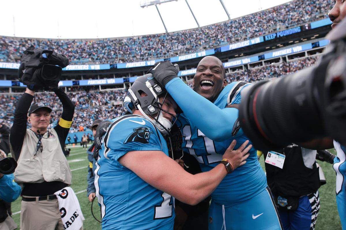 Oct 12, 2025; Charlotte, North Carolina, USA; Carolina Panthers kicker Ryan Fitzgerald (10) celebrates a win against the Dallas Cowboys with linebacker Nic Scourton (11) at Bank of America Stadium. Mandatory Credit: Scott Kinser-Imagn Images