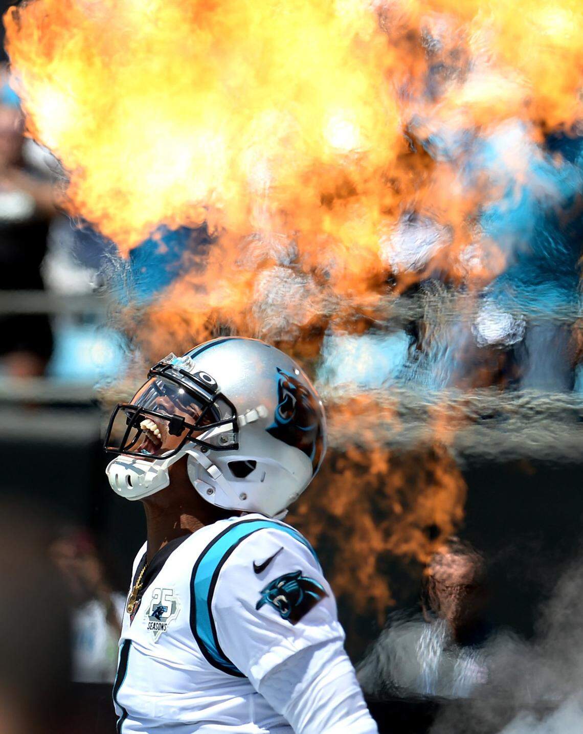 Carolina Panthers quarterback Cam Newton yells as he is introduced during play intros through the shooting flames on Sunday, September 8, 2019 at Bank of America Stadium in Charlotte, NC. The Los Angeles Rams defeated the Panthers 30-27.