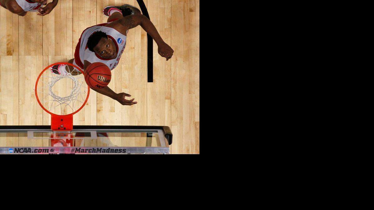 
N.C. State’s Beejay Anya battles for a rebound against LSU in the 2015 NCAA men's basketball tournament at Consol Energy Center on March 19, 2015 in Pittsburgh, Pa. 
