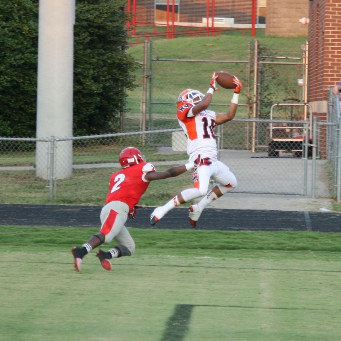 Jaire Alexander, right, is shown making a catch during his senior season at Rocky River High in 2014.