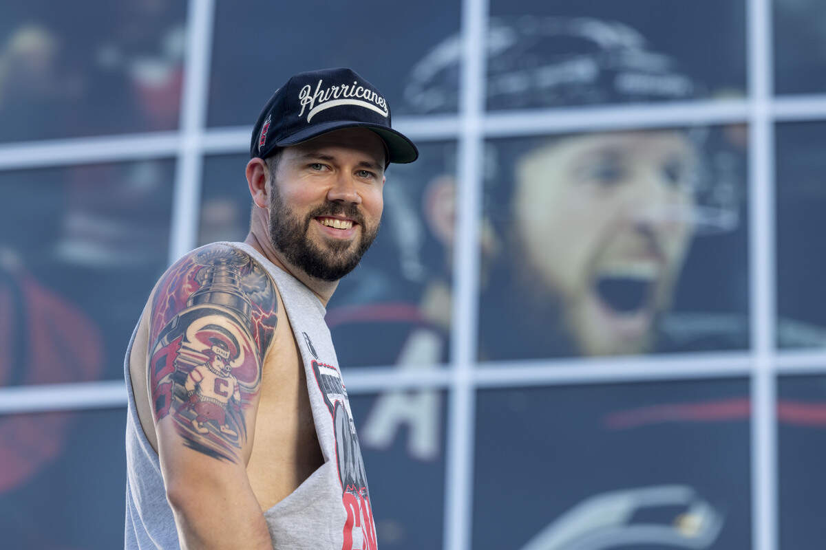 Bryson Karbley acquired a large tattoo celebrating the Carolina Hurricanes’ 2026 Stanley Cup championship on his right arm.  Karbley was photographed against the backdrop of Hurricanes defenseman Jaccob Slavin on Wednesday, July 1, 2026, at Lenovo Center in Raleigh, North Carolina.