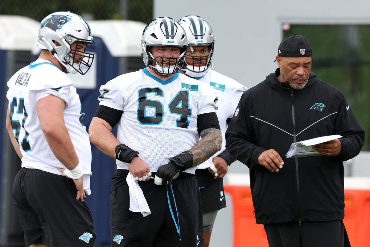 Carolina Panthers center Cade Mays, center, watches his teammates run through a drill during an OTA practice on Tuesday, May 27, 2025. 