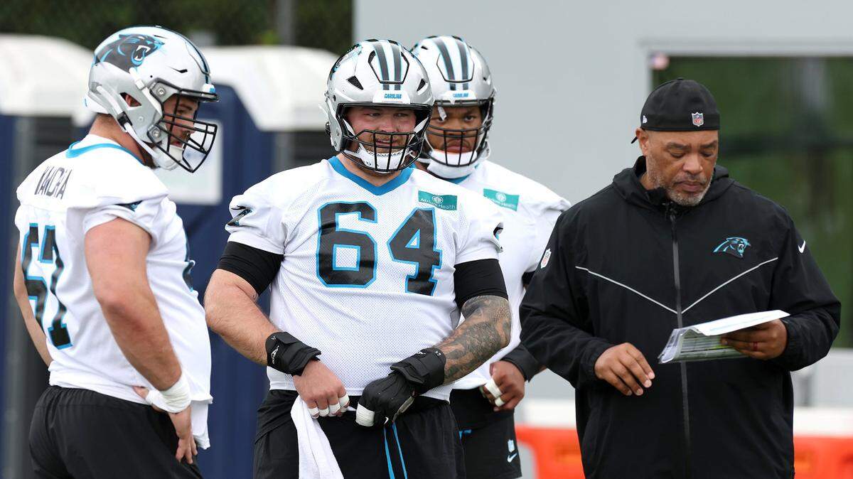 Carolina Panthers center Cade Mays, center, watches his teammates run through a drill during an OTA practice on Tuesday, May 27, 2025.