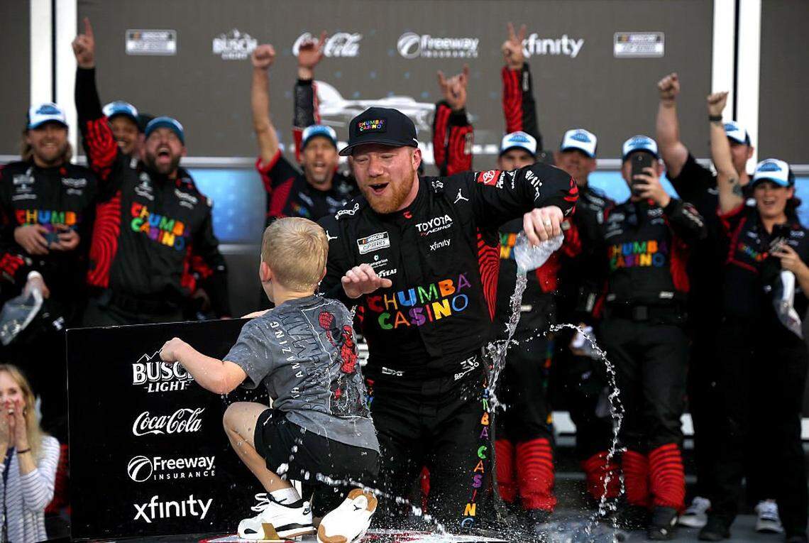 DAYTONA BEACH, FLORIDA - FEBRUARY 15: Tyler Reddick, driver of the #45 Chumba Casino Toyota, and son, Beau Reddick celebrate in victory lane after winning the NASCAR Cup Series Daytona 500 at Daytona International Speedway on February 15, 2026 in Daytona Beach, Florida. (Photo by Chris Graythen/Getty Images)