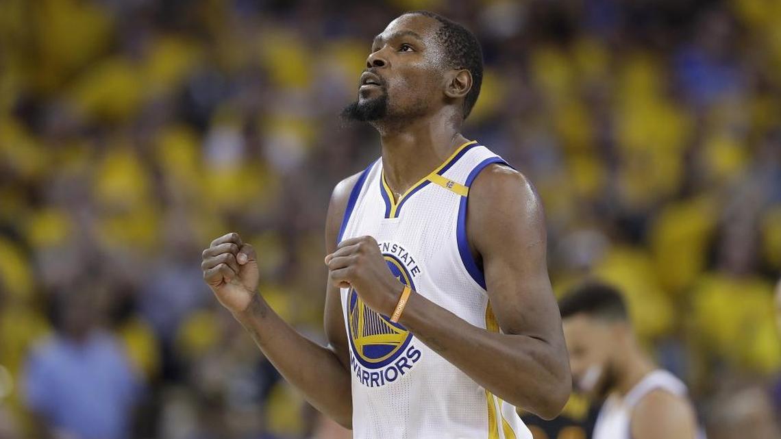 Golden State Warriors forward Kevin Durant reacts after scoring against the Cleveland Cavaliers during the second half of Game 5 of basketball's NBA Finals in Oakland, Calif., Monday, June 12, 2017. (AP Photo/Marcio Jose Sanchez)