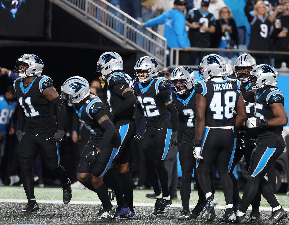 Carolina Panthers players celebrate during the wild card playoff game against the Los Angeles Rams at Bank of America Stadium on Saturday, Jan. 10, 2025 in Charlotte