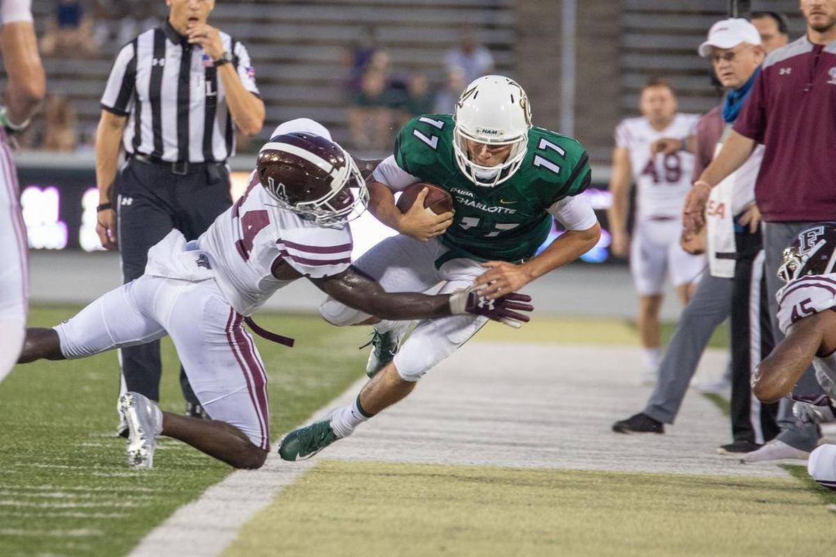 In his first start for the Charlotte 49ers last Saturday against visiting Fordham, redshirt freshman Chris Reynolds (right) completed 13 of 20 passes for 267 yards and a touchdown.