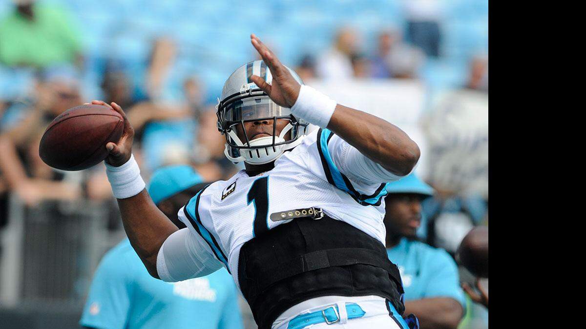 Carolina Panthers' Cam Newton warms up before an NFL football game against the Minnesota Vikings in Charlotte, Sunday, Sept. 25, 2016.