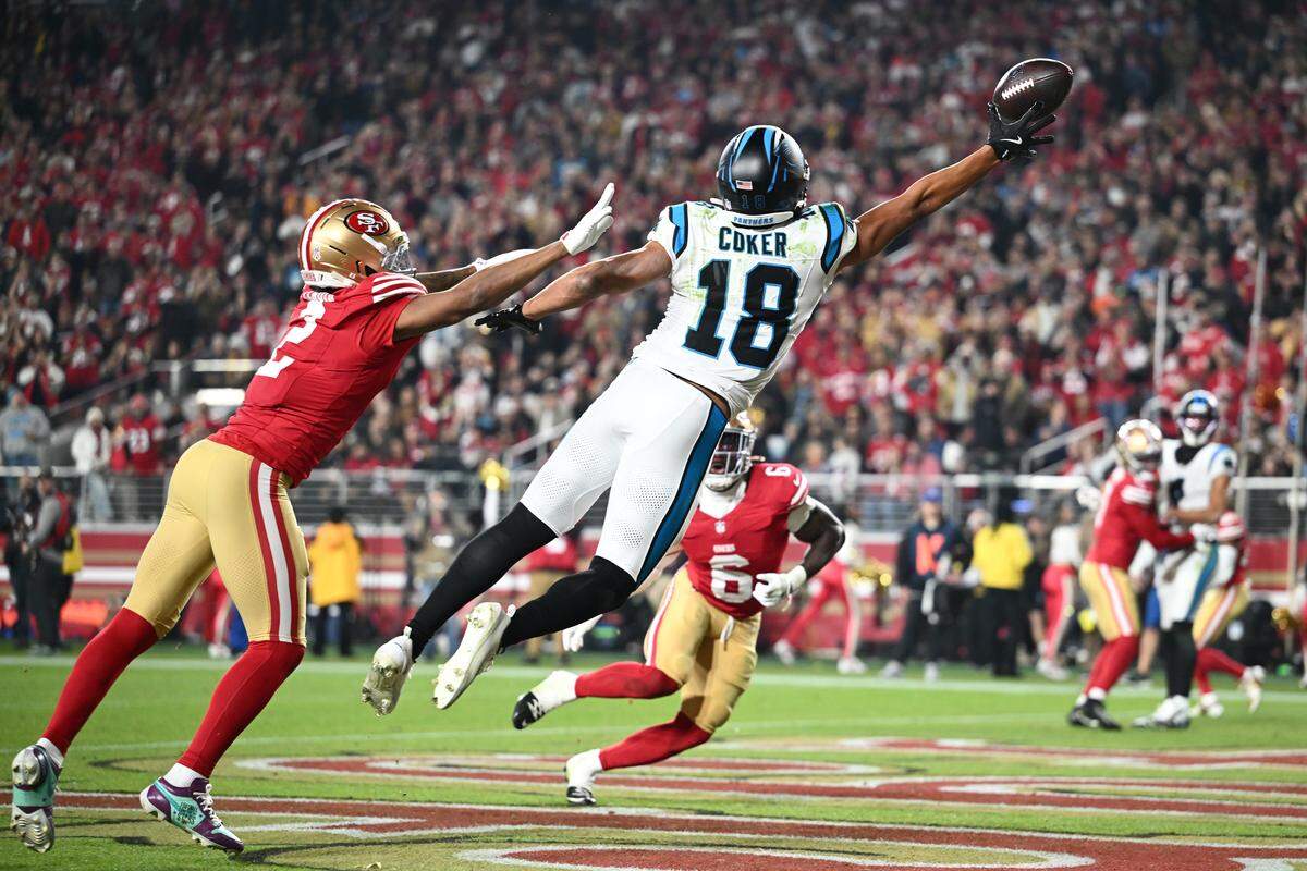 Jalen Coker (18) of the Carolina Panthers attempts to complete the two-point conversion in the third quarter against the San Francisco 49ers on Monday at Levi's Stadium in California.