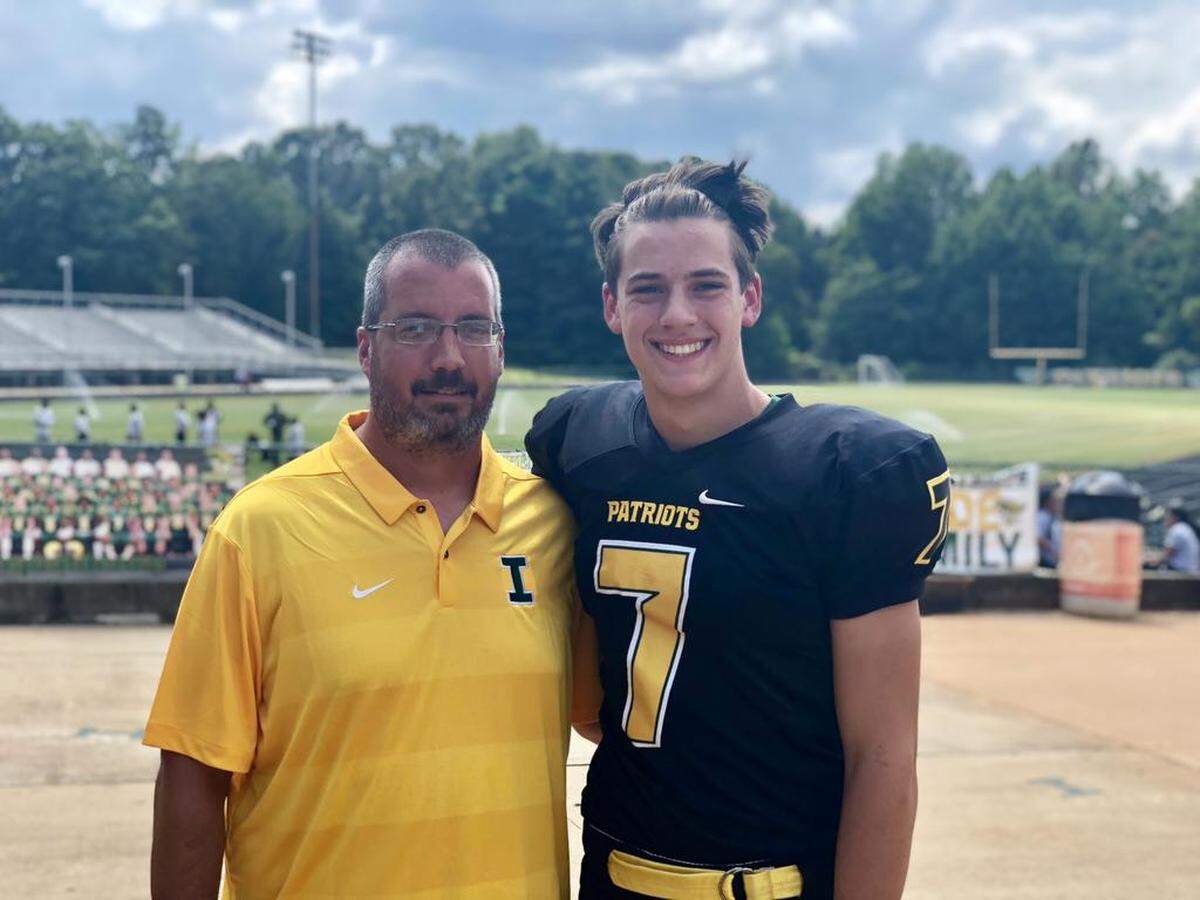 Independence High football coach Mike Natoli (left) and senior quarterback Luke McPhail have led the Patriots to a 2-0 start.