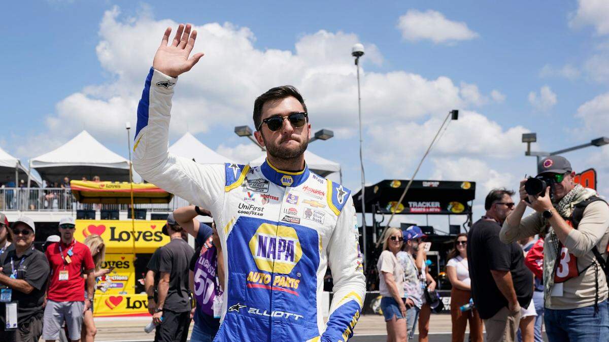 Chase Elliott waves to fans before a NASCAR Cup Series auto race Sunday, June 20, 2021, in Lebanon, Tenn. (AP Photo/Mark Humphrey)