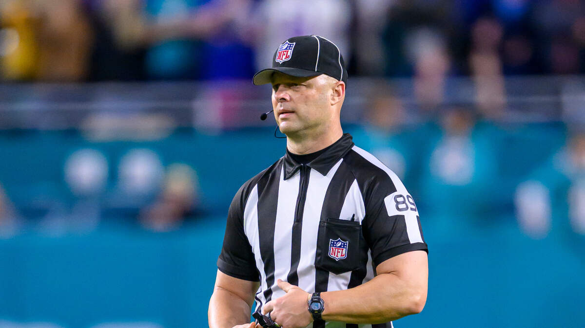 NFL umpire Mike Morton stands on the field during an NFL football game between the Buffalo Bills and the Miami Dolphins, Sunday, Jan. 7, 2024, in Miami Gardens, Fla. (AP Photo/Doug Murray)