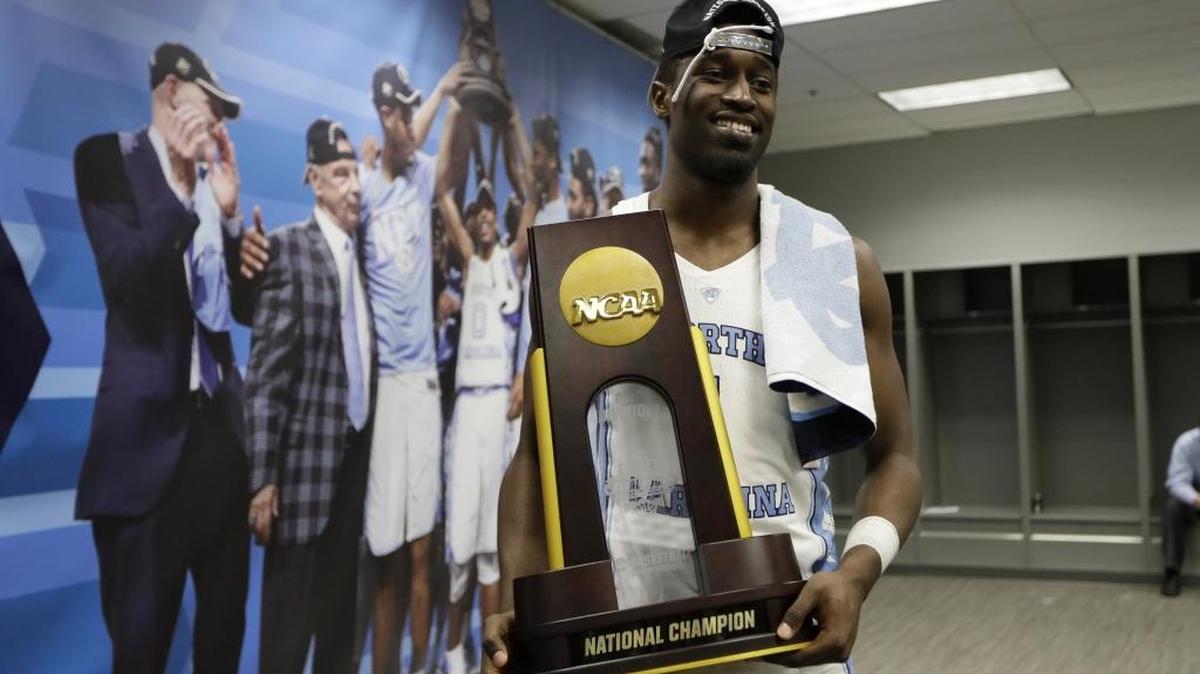 North Carolina forward Theo Pinson holds the trophy in the locker room after the championship game against Gonzaga at the NCAA championship. A former coach thinks the NCAA may introduce a 3-on-3 tournament in the future. (AP Photo/Mark Humphrey)