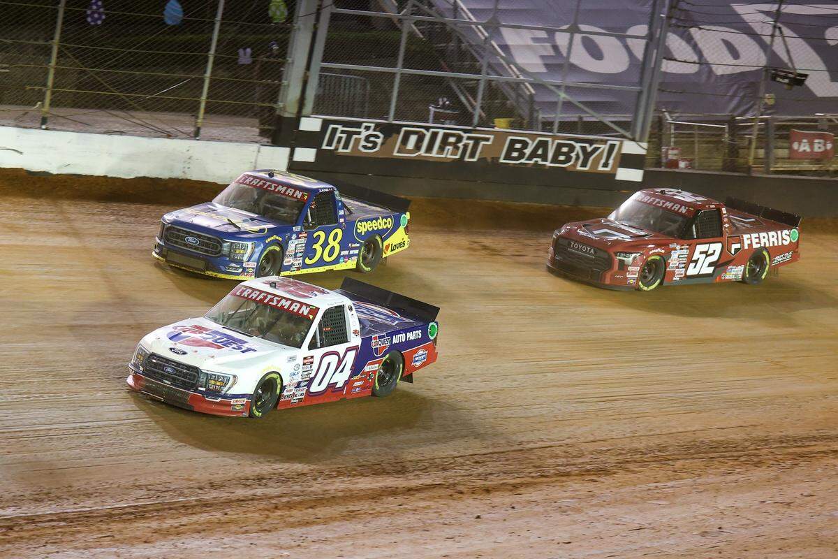 Apr 8, 2023; Bristol, Tennessee, USA; NASCAR Gander RV and Outdoors Truck Series driver Kaden Honeycutt (04) and driver Zane Smith (38) and driver Stewart Friesen (52) at Bristol Motor Speedway Dirt Course. Mandatory Credit: Randy Sartin-USA TODAY Sports