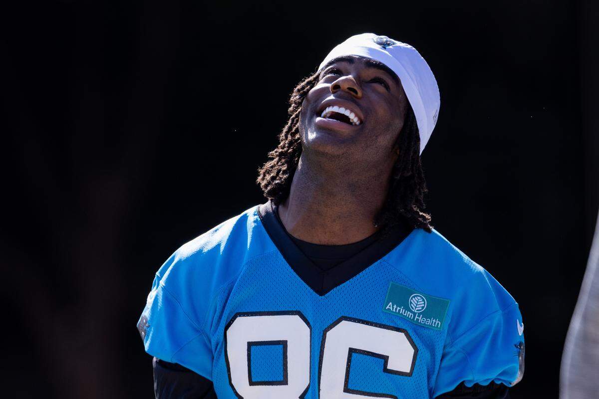 Jul 24, 2025; Charlotte, NC, USA; Carolina Panthers wide receiver Kobe Hudson (86) laughs as he heads to training camp. Mandatory Credit: Scott Kinser-Imagn Images