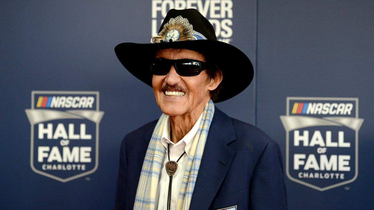 NASCAR legend and Hall of Fame member Richard Petty smiles for photographers as he walks the red carpet at the NASCAR Hall of Fame in Charlotte, NC on Friday, February 1, 2019. Petty is the ambassador of NASCAR race team Legacy Motor Club.