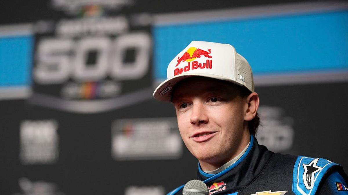DAYTONA BEACH, FLORIDA - FEBRUARY 11: Connor Zilisch, driver of the #88 Red Bull Chevrolet, speaks to the media during Media Day for the NASCAR Cup Series Daytona 500 at Daytona International Speedway on February 11, 2026 in Daytona Beach, Florida. (Photo by Patrick McDermott/Getty Images)