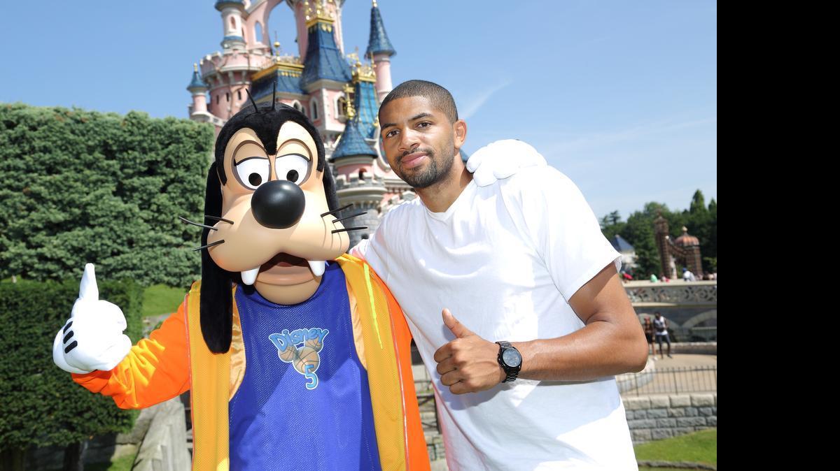
Charlotte Hornets guard/forward Nicolas Batum poses with Goofy while vacationing at Disneyland Paris with his family. Batum, who was acquired by the Hornets last month, also plays for the national French team.
