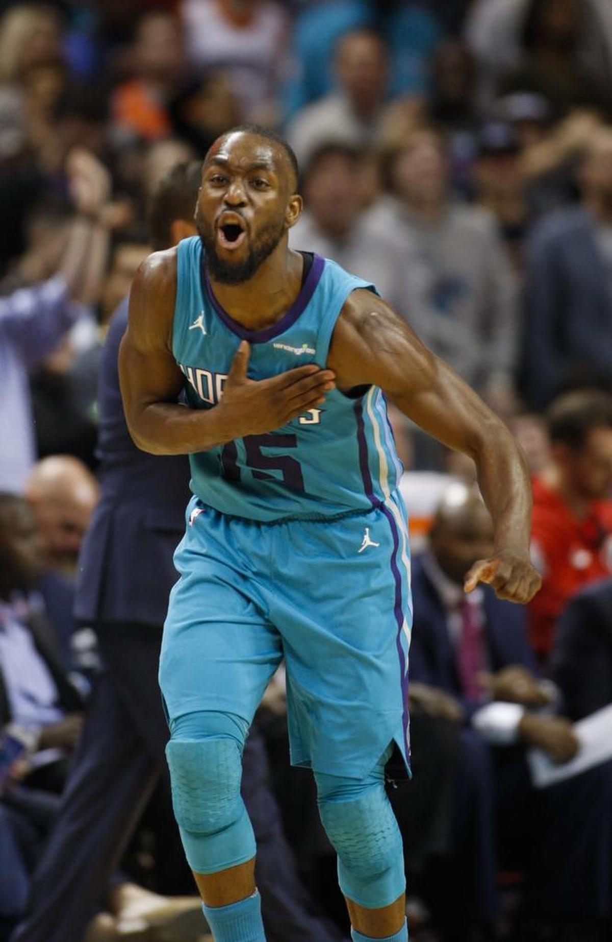 Charlotte Hornets guard Kemba Walker celebrates after scoring during Wednesday night’s 129-124 overtime win against the Washington Wizards. He finished with 24 points, five assists and five rebounds.
