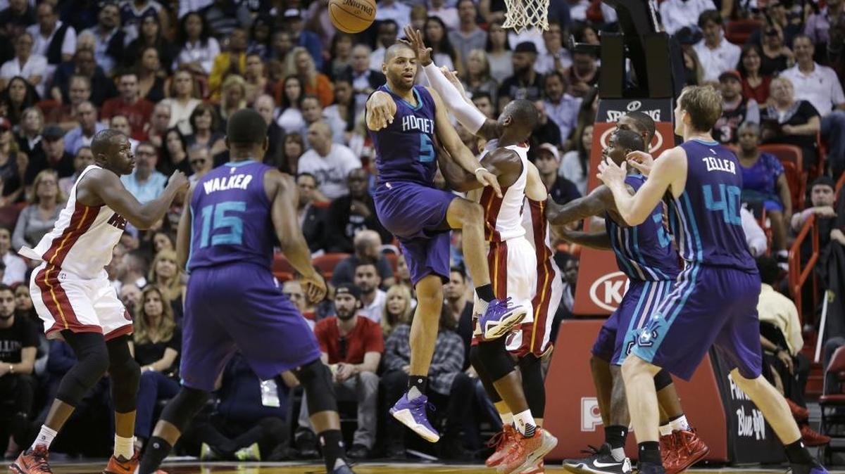 Charlotte Hornets forward Nicolas Batum (5) passes against the Miami Heat Wednesday in Miami. The Heat won 104-94.