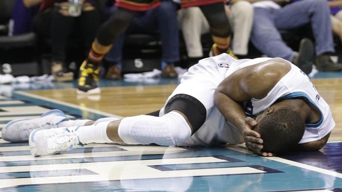 The NBA acknowledged Saturday that Dwayne Wade (3) should have been charged with a foul when he blocked a layup by Kemba Walker (on the floor).