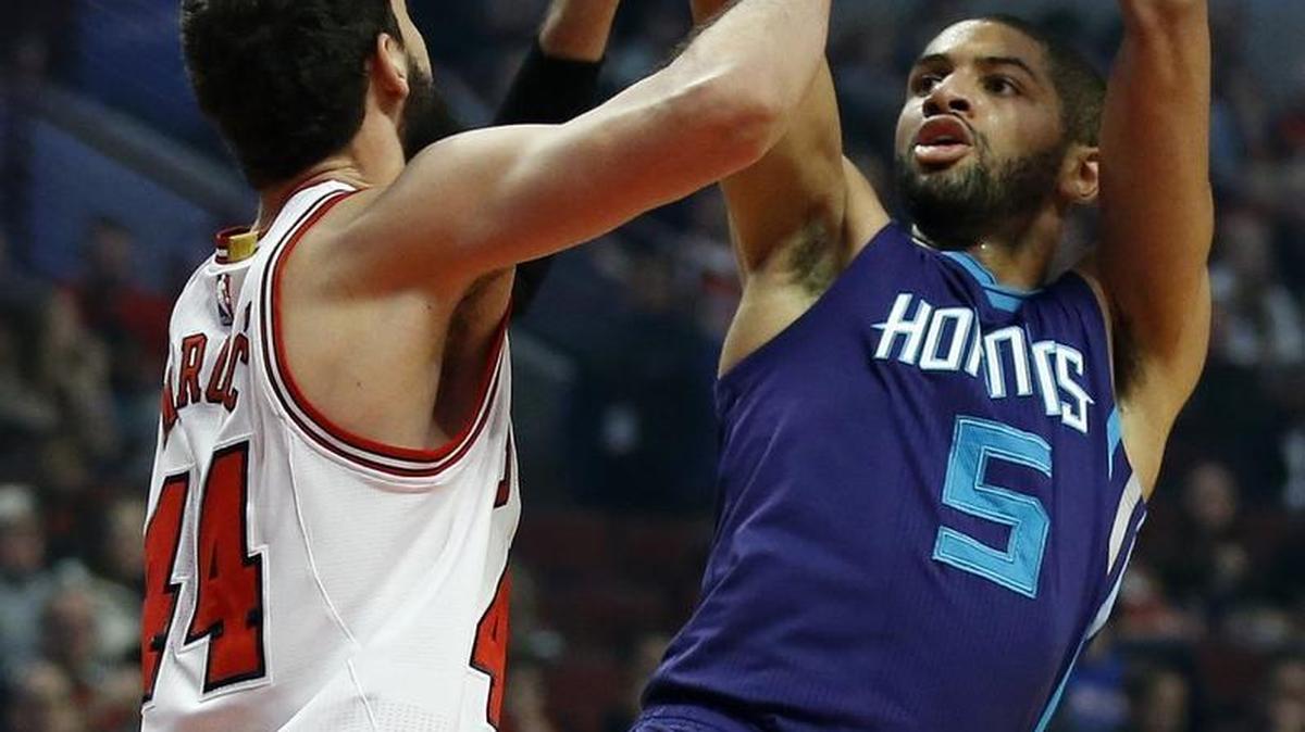Charlotte Hornets guard Nicolas Batum (5) shoots over Chicago Bulls forward Nikola Mirotic during the first half Saturday night in Chicago. Batum scored 24 points.
