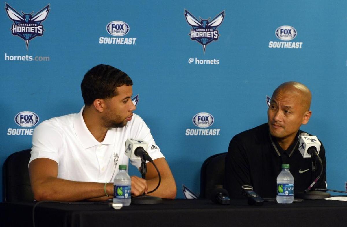 “Any time your best player endorses a player, you’ve got to listen,” Hornets general manager Rich Cho, right, said about Kemba Walker’s sale pitch for point guard Michael Carter-Williams, right.