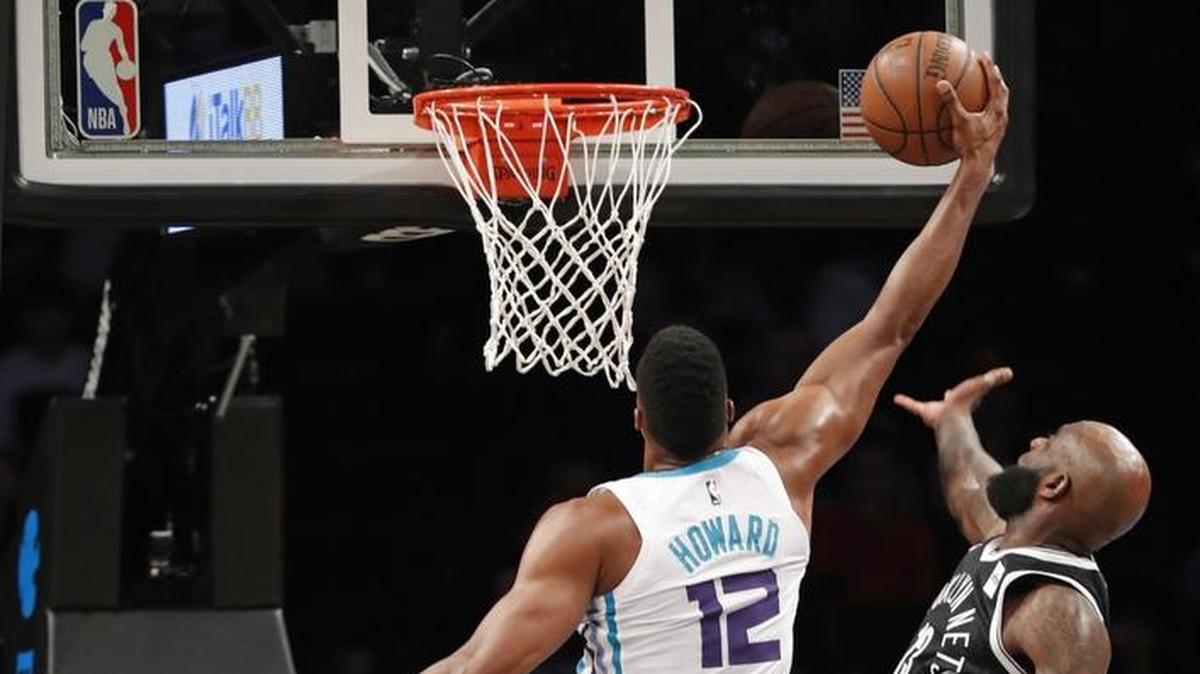 Charlotte Hornets center Dwight Howard (12) finished Wednesday’s 111-105 victory over the Brooklyn Nets and forward Quincy Acy (13) with 32 points and a franchise record 30 rebounds.