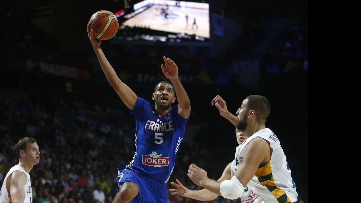 
New Charlotte Hornet Nicolas Batum drives the to the basket while playing for France in the World Championships in 2014.
