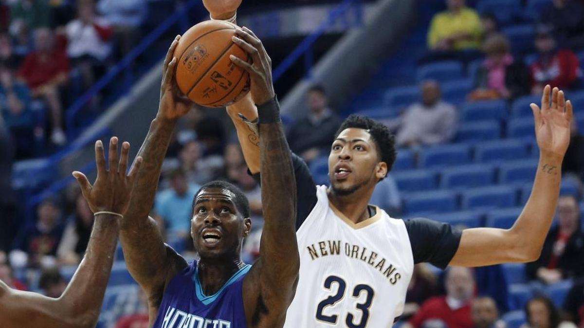 Charlotte Hornets forward Marvin Williams (2) goes to the basket against New Orleans Pelicans forward Anthony Davis (23) on Friday night.