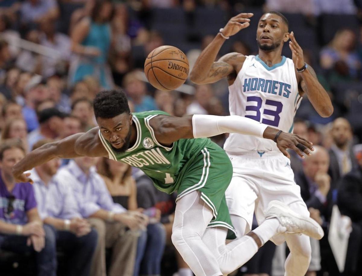 Boston Celtics forward Jaylen Brown (7) steals the ball from Charlotte Hornets guard Terry Henderson (33) in the first half of Wednesday’s preseason NBA basketball game.