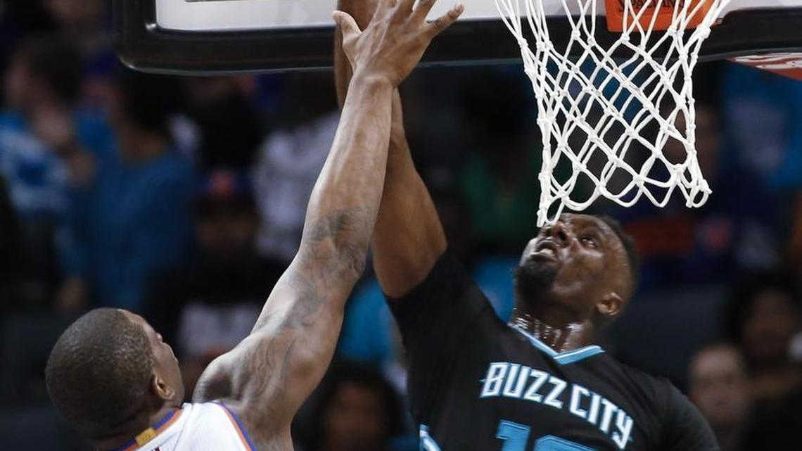 Charlotte Hornets forward P.J. Hairston, right, scores against New York Knicks center Kevin Seraphin during the second half of Saturday’s game. Charlotte won 97-84.
