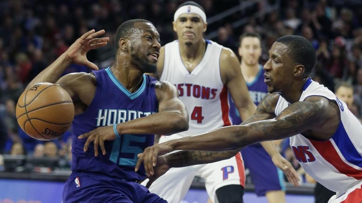 Detroit Pistons guard Kentavious Caldwell-Pope, right, fouls Charlotte Hornets guard Kemba Walker (15) during the second half of Friday’s game in Auburn Hills, Mich. The Pistons won 112-105.
