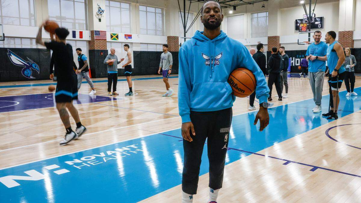 Former Hornets guard Kemba Walker poses after practice at Spectrum Center in Charlotte, NC on Tuesday, December 31, 2024. Now that he is retired, Walker is joining the Hornets coaching staff as a player enhancement coach.