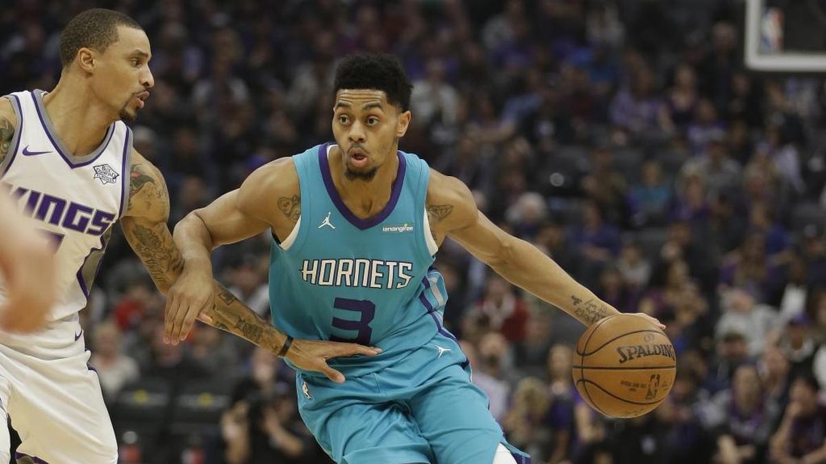 Charlotte Hornets guard Jeremy Lamb, right, drives against Sacramento Kings guard George Hill during the first quarter of Tuesday’s NBA game in Sacramento, Calif. The Hornets won 131-111.