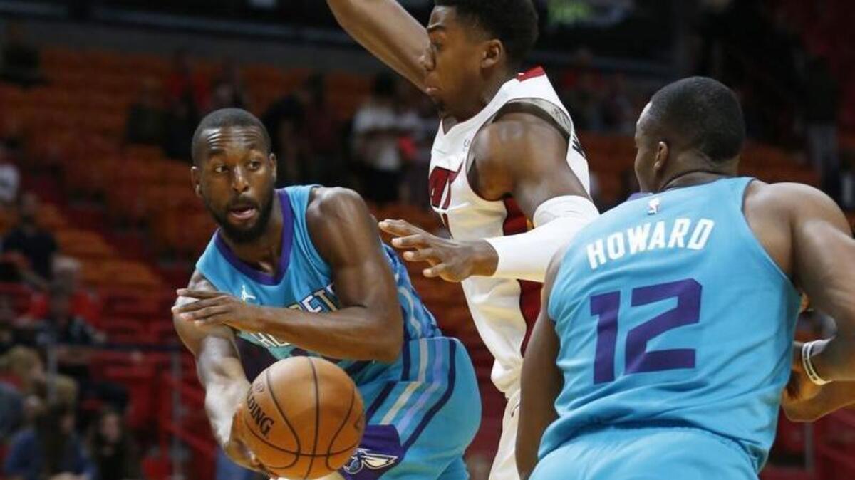 Kemba Walker (with ball) and Dwight Howard (12) will be key members of the Charlotte Hornets’ roster this season.