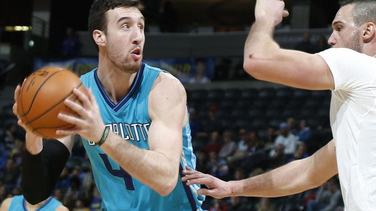Charlotte Hornets center Frank Kaminsky III, left, looks to take a shot as Denver Nuggets forward Danilo Gallinari, of Italy, defends Sunday night.