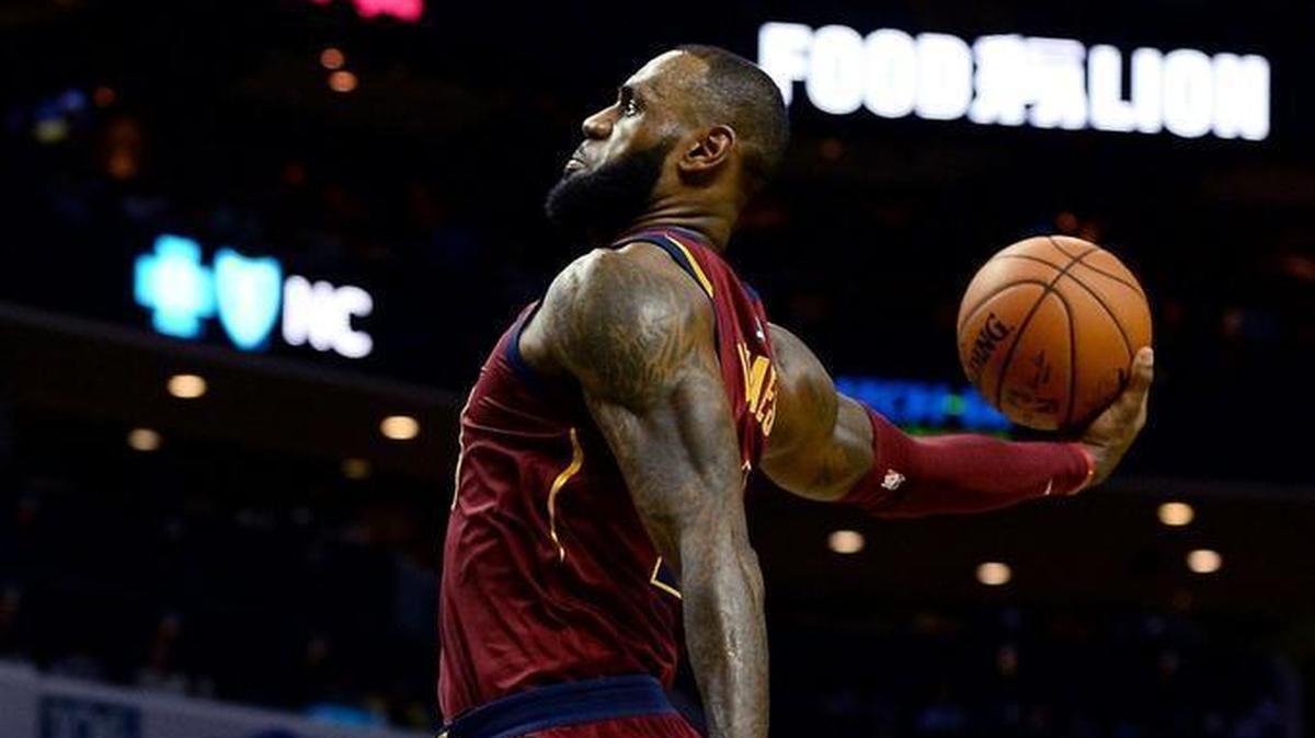 Cleveland Cavaliers forward Lebron James soars for dunk against the Charlotte Hornets in the fourth quarter of Wednesday’s NBA game at the Spectrum Center. James scored 31 points in the Cavaliers’ 115-107 win.
