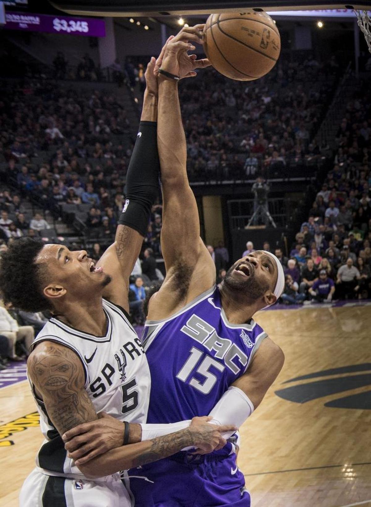 Sacramento Kings guard Vince Carter (15) strips the ball from the San Antonio Spurs guard Dejounte Murray (5) in a January game. “You’re not supposed to be able to still jump and shoot the way that he can at 40 years old,” rookie teammate Justin Jackson said Monday. “It’s the reason he’s going to be in the Hall of Fame.”