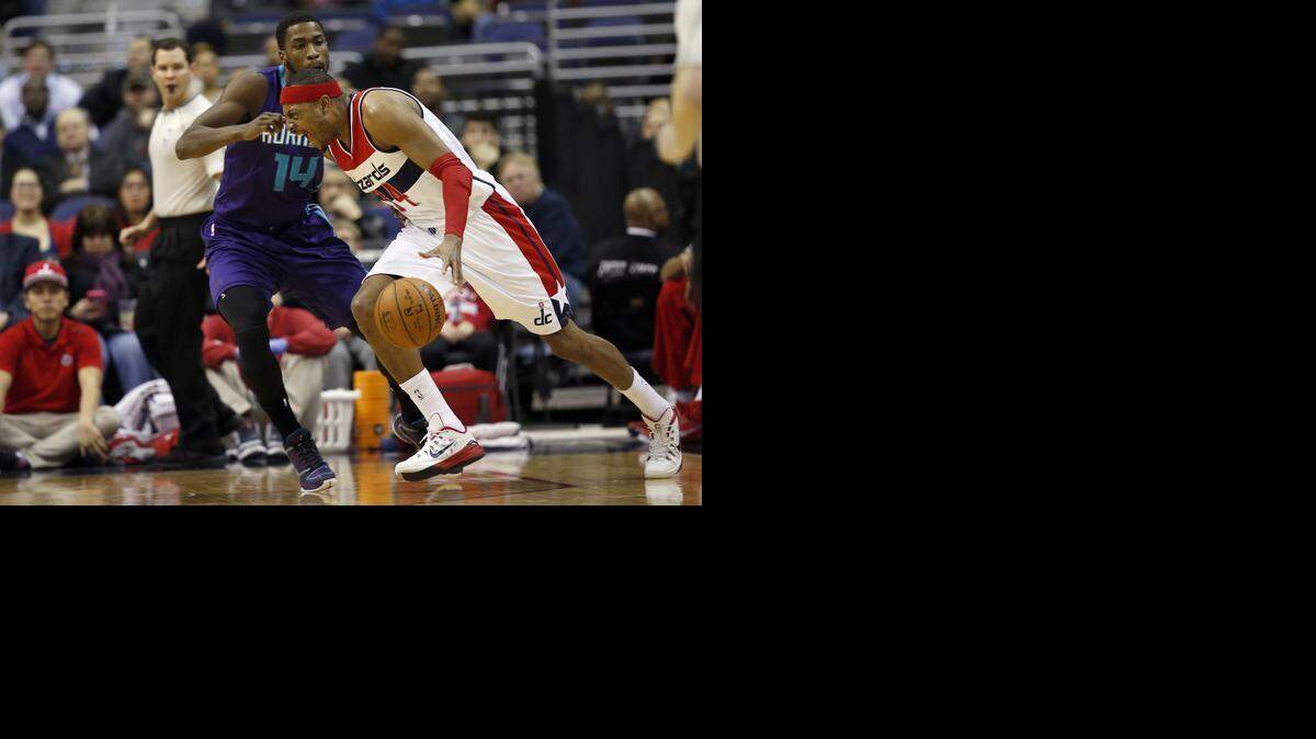 
Charlotte Hornets forward Michael Kidd-Gilchrist (14), here guarding Washington Wizard Paul Pierce, impacts his team’s bottom line with great energy.

