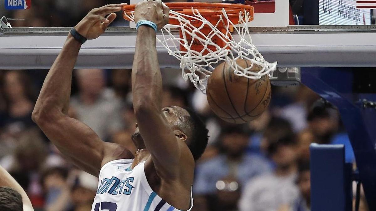 Charlotte Hornets forward Dwight Howard scores on a reverse dunk during the second half of Saturday’s game. Howard pulled down 23 rebounds and scored 18 points and the Hornets won 102-98.
