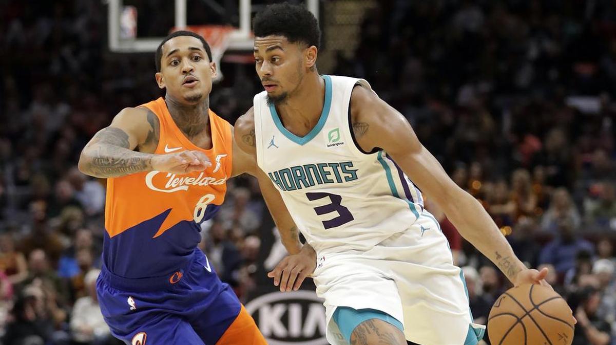 Charlotte Hornets guard Jeremy Lamb, right, drives against the Cleveland Cavaliers’ Jordan Clarkson in the second half of Tuesday’s NBA game in Cleveland. The Cavaliers won 113-89.