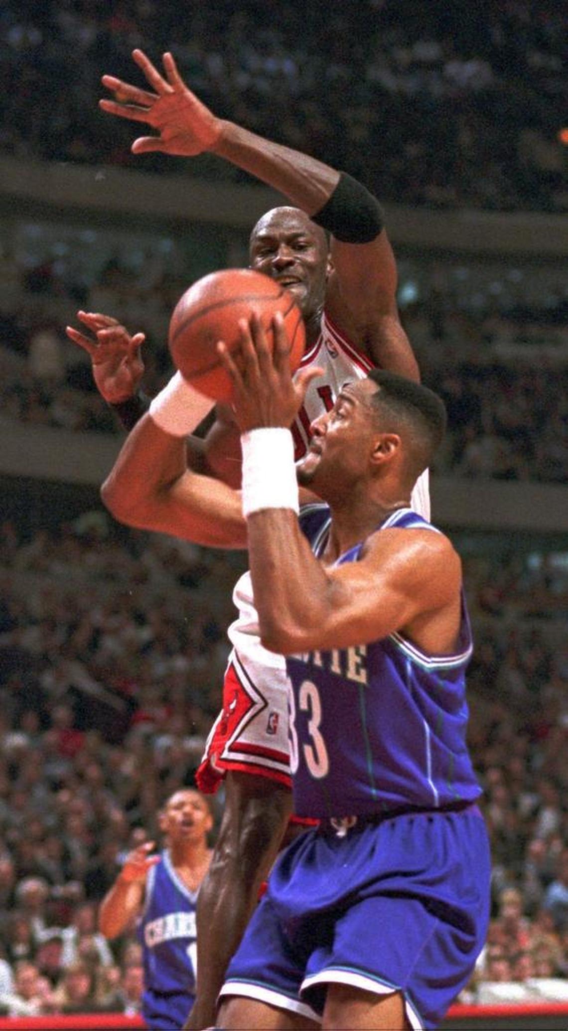 Charlotte Hornets center Alonzo Mourning looked to score over then-Chicago Bulls star Michael Jordan in a 1995 playoff series. Jordan now owns the Hornets and Mourning is an executive in the Miami Heat’s front office.