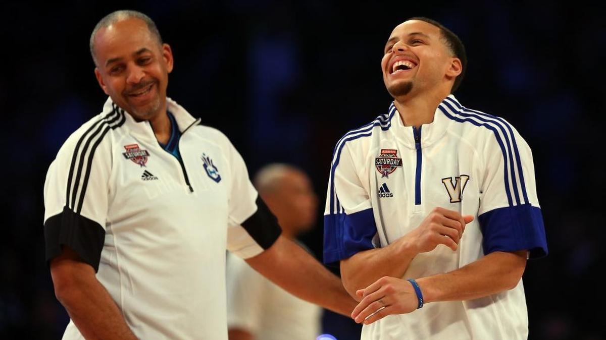 Stephen Curry, right, jokes with his father and NBA Legend Dell Curry during the Shooting Stars Competition, part of the 2015 NBA Allstar Weekend at Barclays Center.
