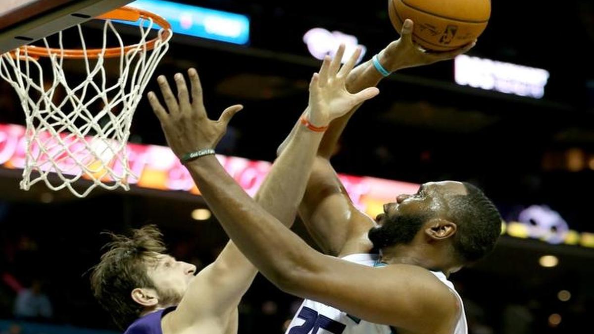 Al Jefferson #25 of the Charlotte Hornets shoots over Mirza Teletovic #35 of the Phoenix Suns during their game at Time Warner Cable Arena on March 1, 2016 in Charlotte.