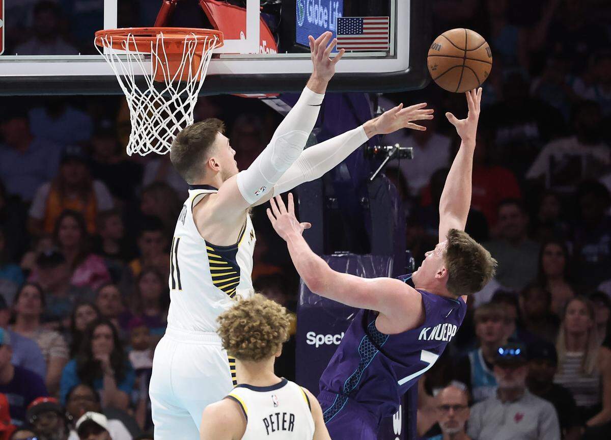 Charlotte Hornets forward Kon Knueppel takes the shot as Indiana Pacers forward Micah Potter tries to block during the game Friday, April 3, 2026 at Spectrum Center in Charlotte.