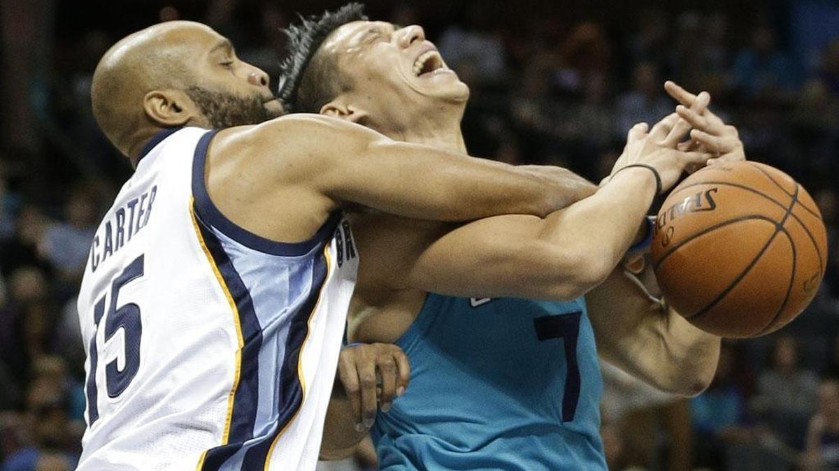Charlotte Hornets' Jeremy Lin, right, is fouled by Memphis Grizzlies' Vince Carter during the first half of Saturday’s game in Charlotte.