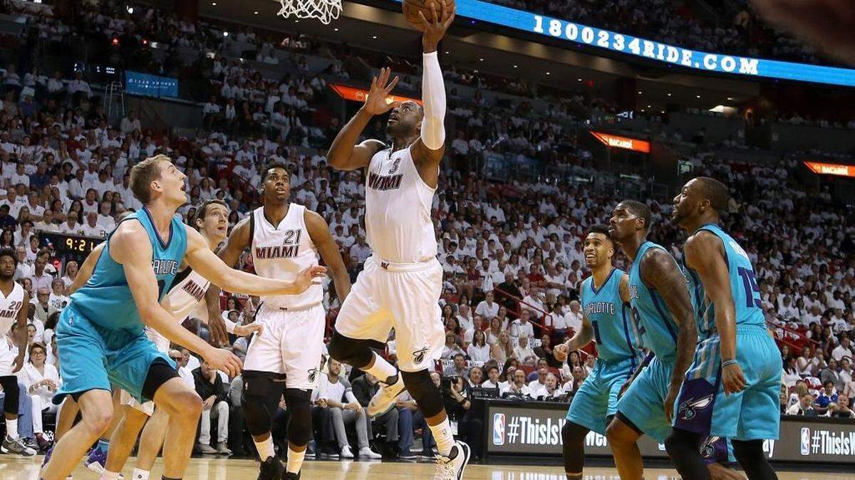 Miami Heat's Dwyane Wade scores during the first half of Sunday’s game in Miami.
