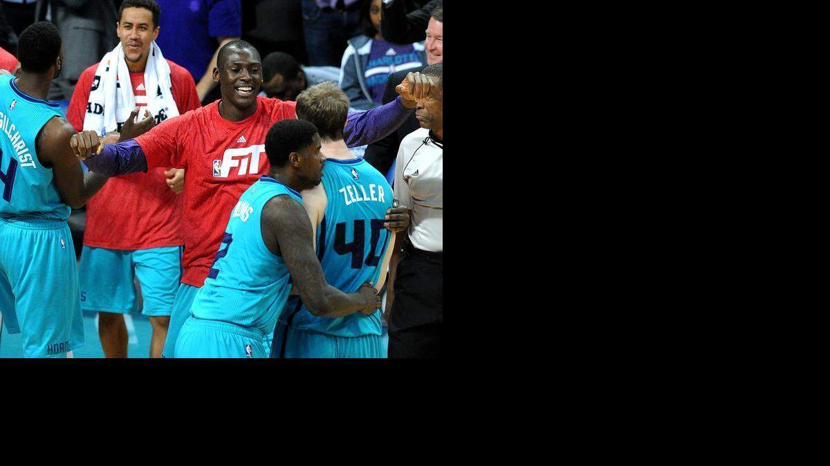 
Charlotte Hornet Bismack Biyombo (center, congratulating teammates) went out in freezing temperatures Tuesday night in Chicago to get a homeless man a meal.



